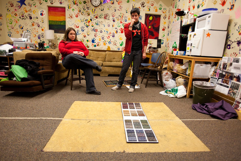 Vandalized LGBTQA offices with the swastika carpet removed by police