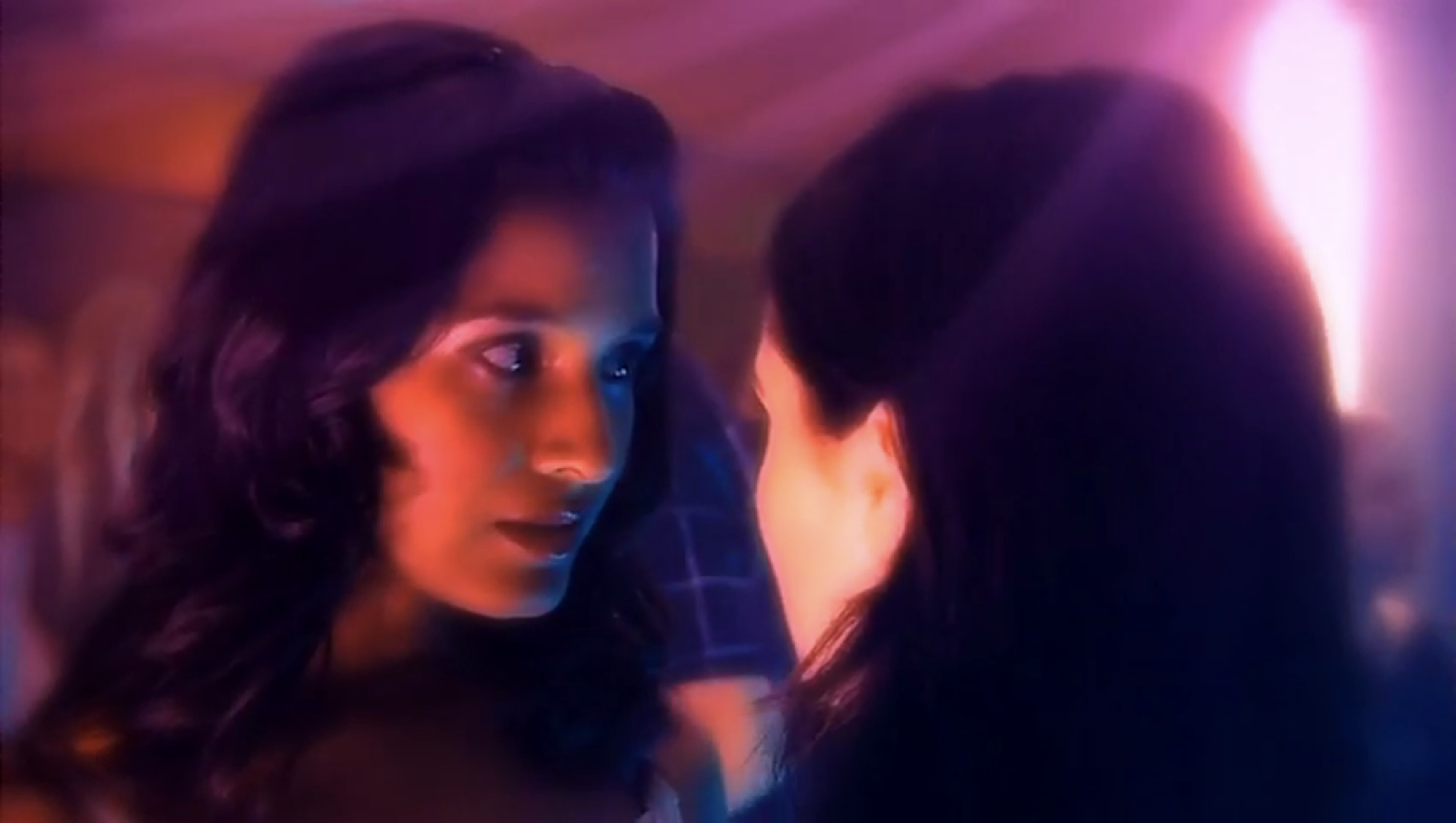 The best lesbian night club scenes: Shelley Conn and Laura Fraser make eye contact with glowy overexposed colors in Nina's Heavenly Delights