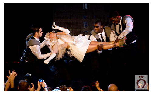 How many masked gays does it take to lift little Gaga?