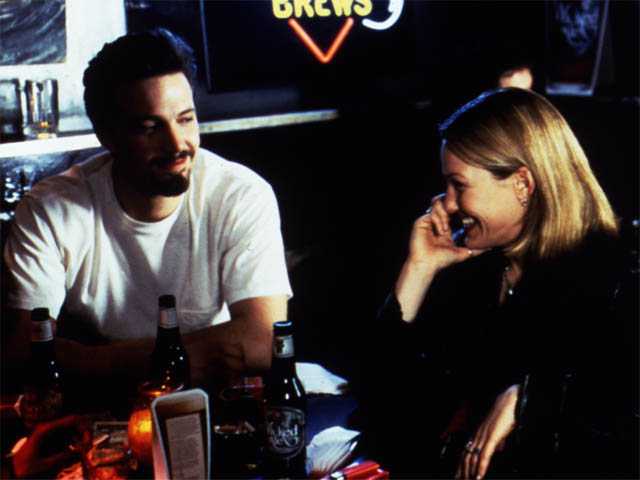 Alyssa and Holden look at each other and laugh in the bar. Chasing Amy queer 