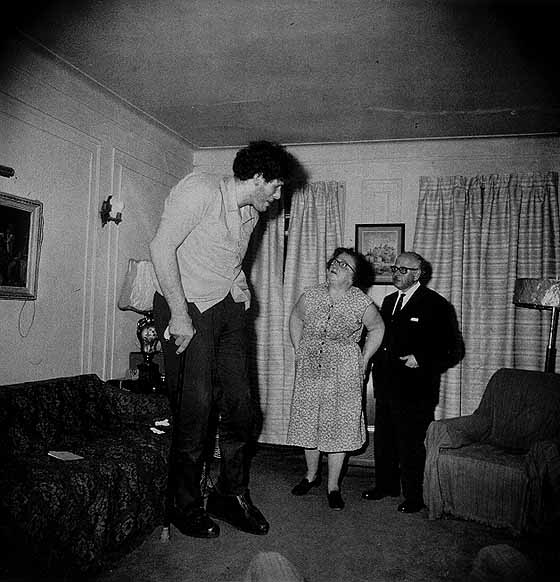 A Jewish giant at home with his parent in the Bronx, N.Y. 1970