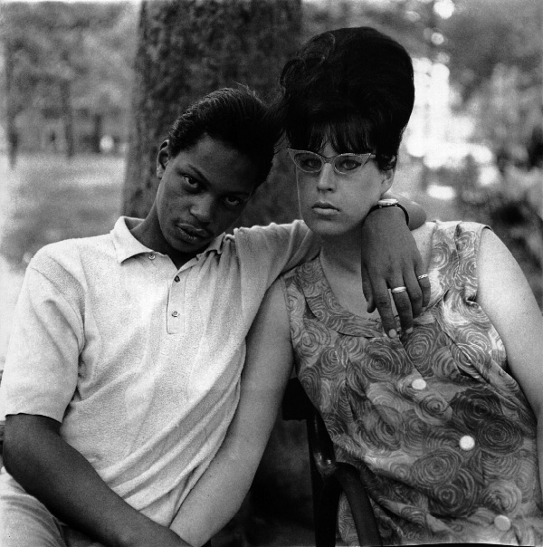 A young man and his pregnant wife in Washington Square Park, NY 1965