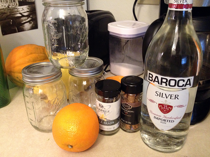 Supplies needed: White rum, an orange, two vanilla beans, two cinnamon sticks, jars, patience, funnel, coffee filters.
