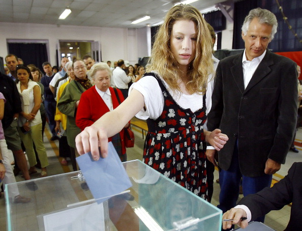 "French Prime Minister Dominique De Villepin (R) watches his daughter Marie casting her vote, 22 April 2007 in Paris for the first round of the French presidential election." (FRANCK FIFE/AFP/Getty Images)