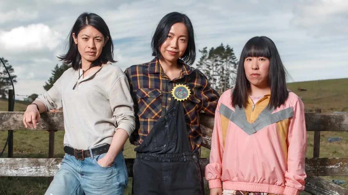 a girl in a gret sweater, alex in a flannel and overalls, pip in a pink top