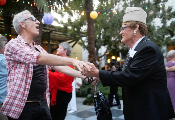 Brian Frank, left, a volunteer at the L.A. Gay and Lesbian Center, dances with Rosie Del Mar at the center's prom in Hollywood.