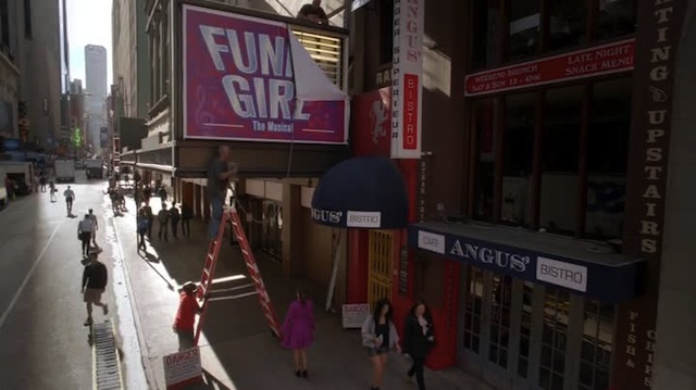 rachel had selected her magenta coat because it matched the shade of her favorite JimmyJane personal vibe, but was pleased to discover its complementary tones also matched the Funny Girl sign 