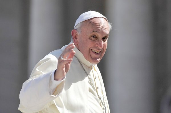 Pope Francis waving and looking friendly