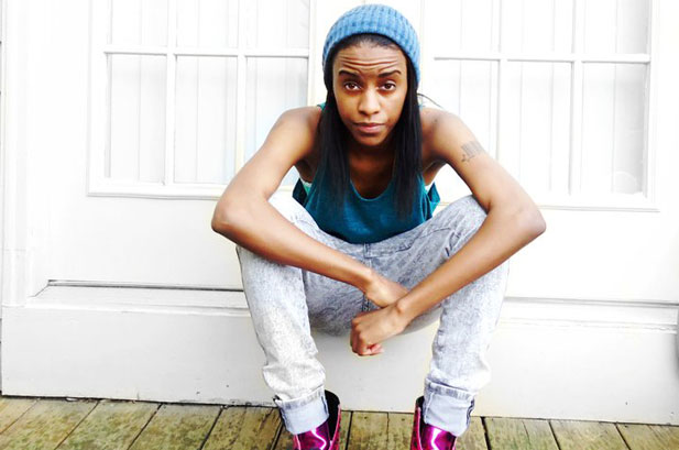 Angel Haze in a blue beanie