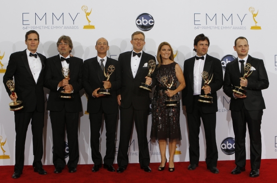 "Alex Gansa (C) and fellow writers pose with their award for outstanding writing for a drama series for "Homeland," backstage at the 64th Primetime Emmy Awards in Los Angeles, September 23, 2012. (Photo : Reuters)"