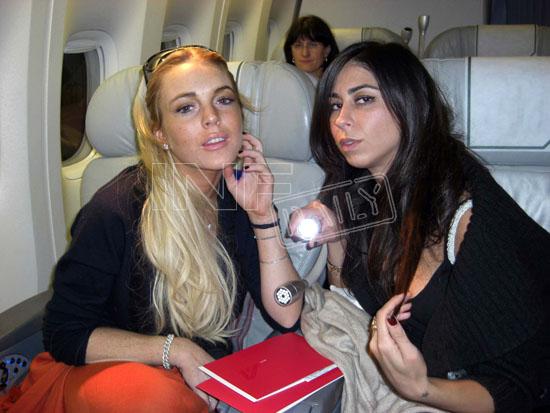 Exclusive - Lindsay Lohan & Courtenay Semel Get Cozy on Flight to Capri