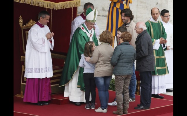 Pope Francis greets a family as they present the offertory gifts during a Mass for families Oct. 27 in St. Peter's Square at the Vatican. The Mass was the culmination of the Year of Faith pilgrimage of families. (CNS/Paul Haring) via NCR Online.