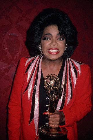 Oprah Winfrey Holding an Emmy Award