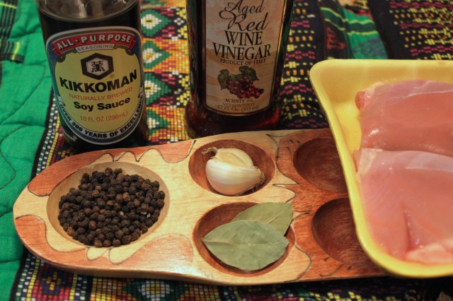 Adobo ingredients: peppercorns, garlic, bay leaves, soy sauce, red wine vinegar.