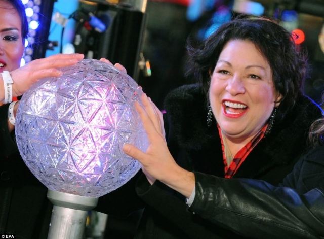 Justice Sonia Sotomayor prepares to push the Waterford crystal button that signals the descent of the New Year's Eve Ball. Via Daily Mail.