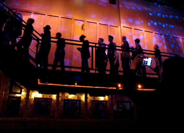 Models line up along the stairs, getting into their final positions for the runthrough. Copyright Joi Ong.