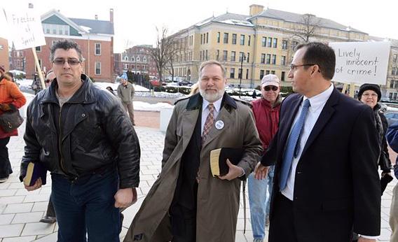 Scott Lively, center, enters U.S. District Court in Jan. 2013,  when first sued by Ugandan activists for his hateful speech via Slate