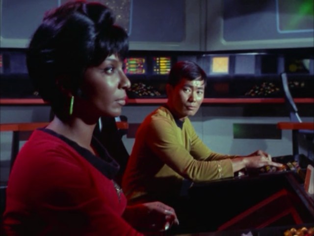 A reminder of why Star Trek TOS was so radical for its time. Two people of color, one of them a woman, piloting the Enterprise during one of its most important conflicts. This is one of my favorite stills.