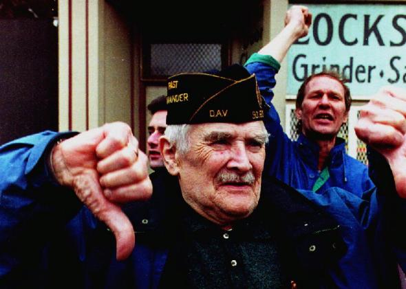 Spectators react to the Irish American Gay, Lesbian, and Bisexual Group of Boston during their appearance in the 1993 South Boston St. Patrick's Day Parade. Subsequently, theSupremeCourt recognized the organizers' right to exclude groups. Photo by John Mottern/AFP/Getty Images via Slate.