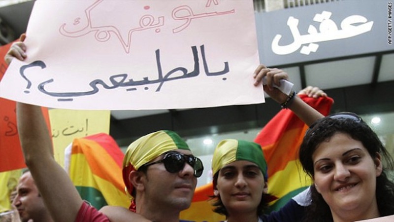 Protestors gathered in Beirut, Lebanon at the International Day Against Homophobia in 2010. Their sign reads, "What do you know about normal?" via muftah.org