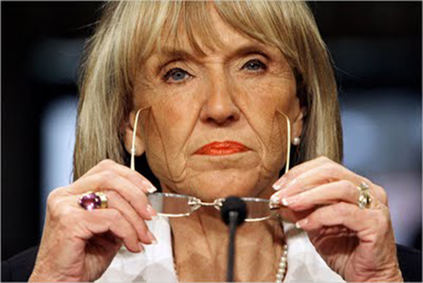 ARIZONA GOVERNOR JAN BREWER - HAIR DOWN, GLASSES OFF.
