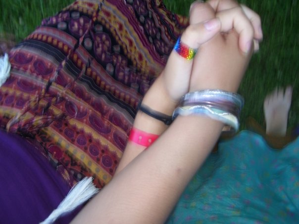 My hand is the one with the very straight rainbow thumb ring on it.