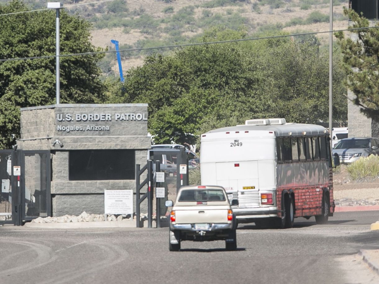 A bus carrying detainees enters the Nogales Border Patrol Station. via AZ Central