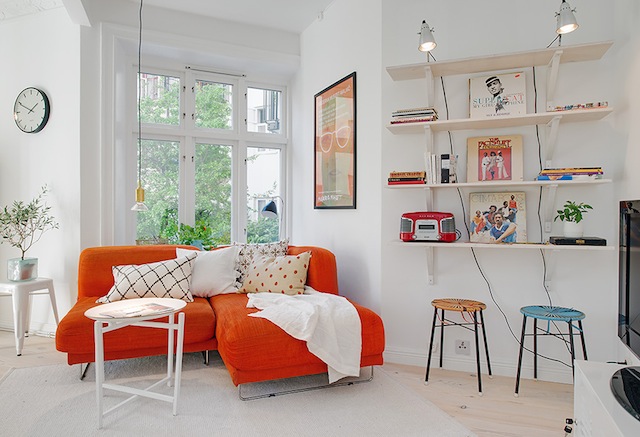 If I owned this sweet orange sofa, I might feel differently about watching television. (Via Zirla)