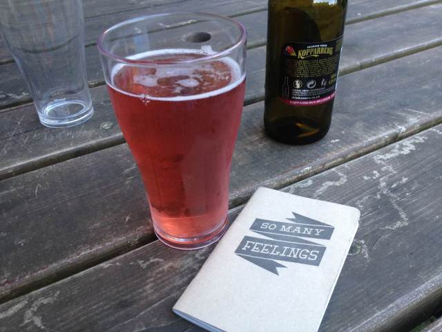 Here, my Autostraddle notebook poses seductively with a fruity cider.