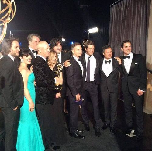 Ryan Murphy holds the Emmy along with cast members of The Normal Heart.