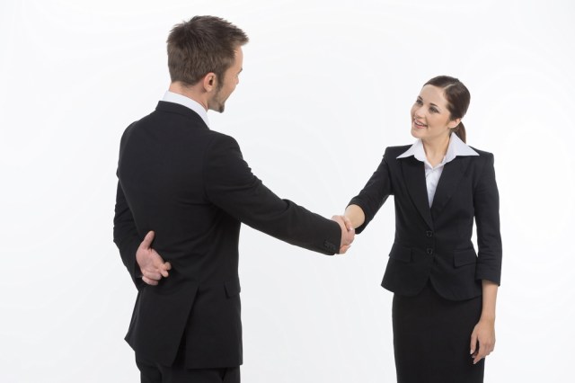 Advice for stock photography businesswomen: always check behind your negotiation partner's back before agreeing to anything. Via Shutterstock.