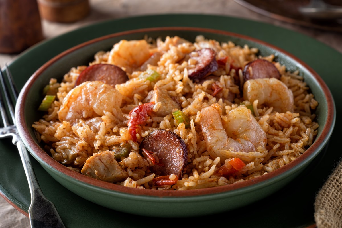 A bowl of delicious cajun style crockpot jambalaya with shrimp, chicken and sausage.