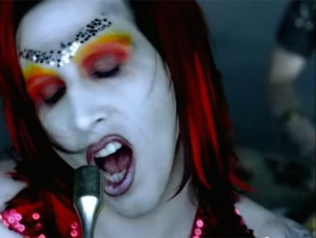Marilyn Manson's glam rock era. Gay police in pink uniforms also make out in this music video.