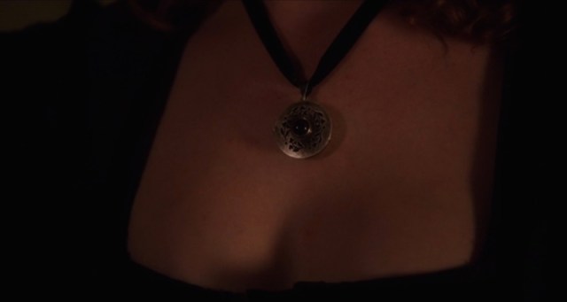 The camera is just following Mary's gaze. That's a beautiful...pendant!
