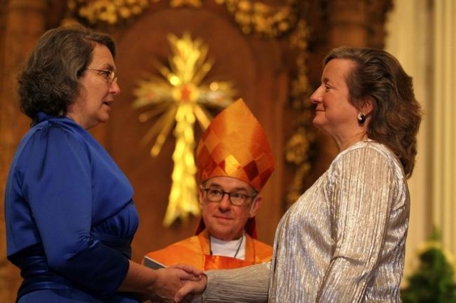 The 2011 marriage of two lesbian Episcopal priests marked one of many recent shifts in the relationship between queer people and the church. Photo via The Patriot Ledger