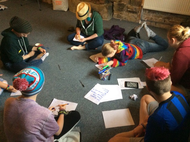 A Young Women's Peer Health Project meeting inside the center image via Young Women's Peer Health Project