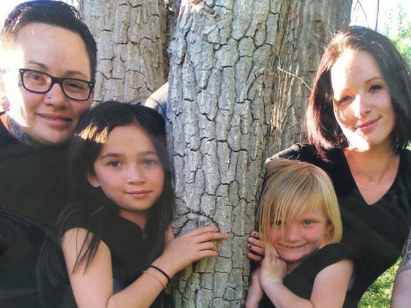Vanessa Collier, far left, with her family. via The Denver Post