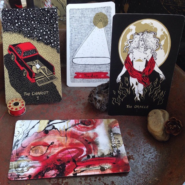 The Chariot, illustration by Ellis Driver / The Sun, illustration by Nic. Jenkins / The Oracle (traditionally The High Priestess), illustration by O Horvath / The Storm (traditionally the Tower) illustration by Kai Barrow