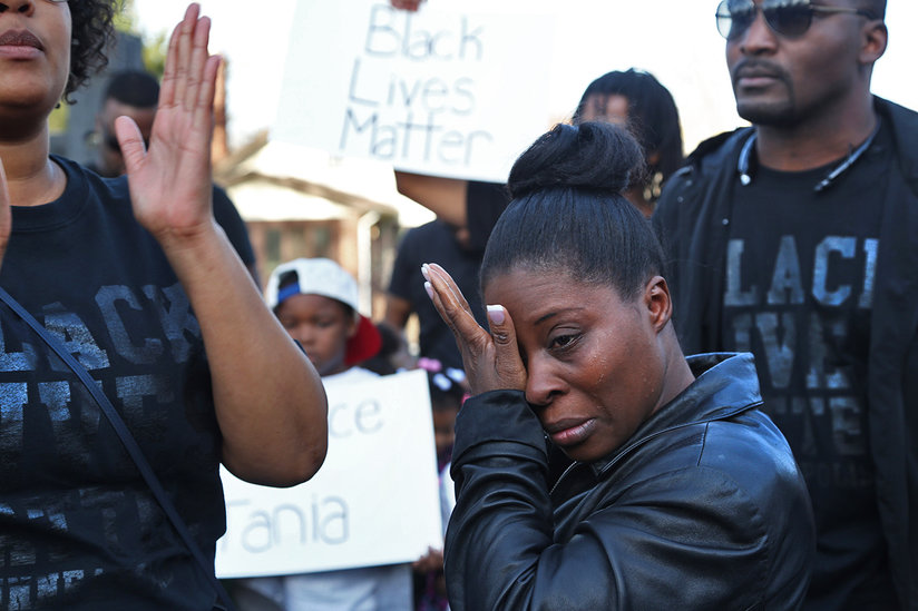 Tania's mother Kim Tolbert wipes away tears while marching to the hospital to see her daughter. By Kyndell Harkness http://www.startribune.com/local/300222321.html