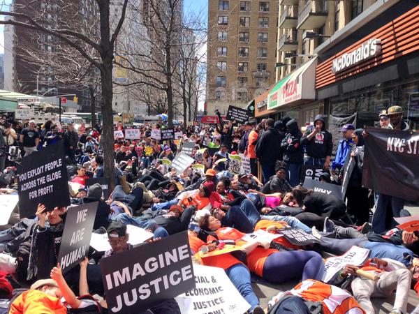 Protesters stage a die-in outside a McDonalds in New York City to show that economic justice is racial justice via @FastFoodFoward Twitter