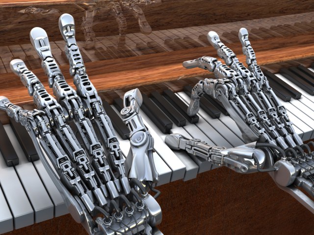 robot hands playing a piano via shutterstock