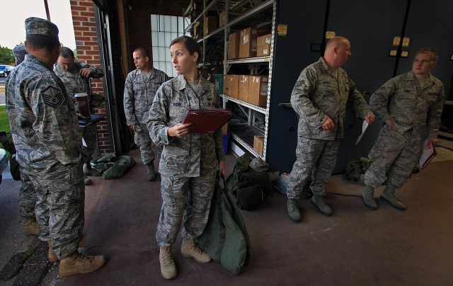 Air Force Reserve senior airman Alicia Perry and others from the 934th wait to pack supplies for a 120-day deployment to Afghanistan in September 2010. (Jim Gehrz/Minneapolis Star Tribune/MCT)