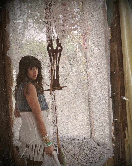 Aja is ready for the fringe festival in her fringed Lovebyrd tank and grown-up denim vest.