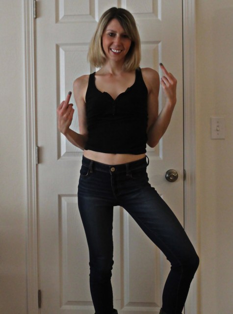 33-year old CEO, Riese Bernard, is reveling in the perfect fit of her American Eagle low-rise jeans while also rocking a plunging neckline crop top and alluringly sophisticated grown-up belly button piercing.