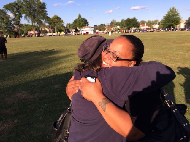 Rebecca O'Hara, Ashton O'Hara's mother receiving a hug from a supporter. via 