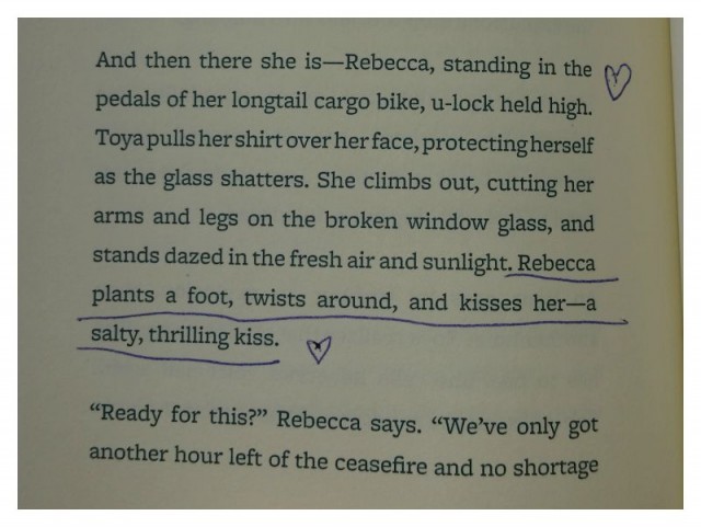 And then there she is -- Rebecca, standing in the pedals of her longtail cargo bike, u-lock held high. Toya pulls her shirt over her face, protecting herself as the glass shatters. She climbs out, cutting her arms and legs on the broken window glass, and stands dazed in the fresh air and sunlight. Rebecca plants a foot, twists around, and kisses her -- a salty, thrilling kiss.