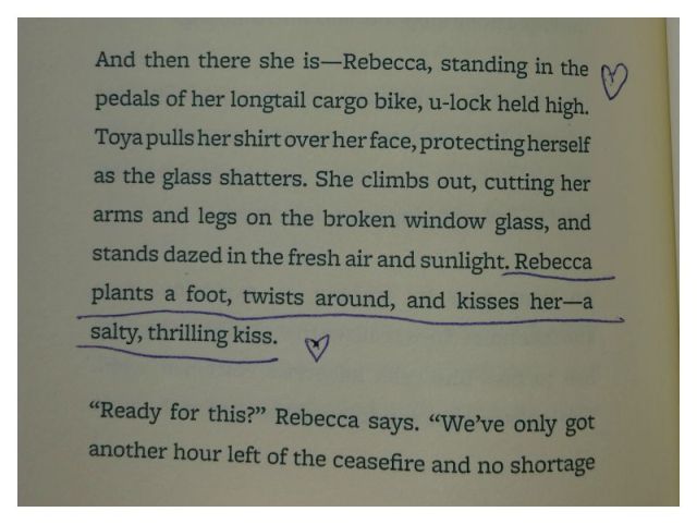 And then there she is -- Rebecca, standing in the pedals of her longtail cargo bike, u-lock held high. Toya pulls her shirt over her face, protecting herself as the glass shatters. She climbs out, cutting her arms and legs on the broken window glass, and stands dazed in the fresh air and sunlight. Rebecca plants a foot, twists around, and kisses her -- a salty, thrilling kiss.