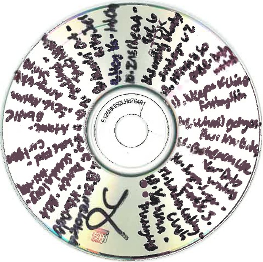 cd with black writing on it
