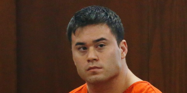 Daniel Holtzclaw, an Oklahoma City police officer accused of sexually assaulting women he encountered while on patrol in neighborhoods near the state Capitol, is pictured in a courtroom during a hearing on whether to cut his bond from $5 million to $139,000, in Oklahoma City, Wednesday, Sept. 3, 2014. (AP Photo/Sue Ogrocki)