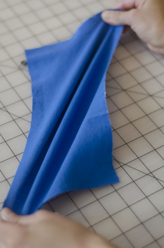 This a woven fabric being stretched on the bias- it doesn't have much stretch when pulled straight up and down or from side to side.